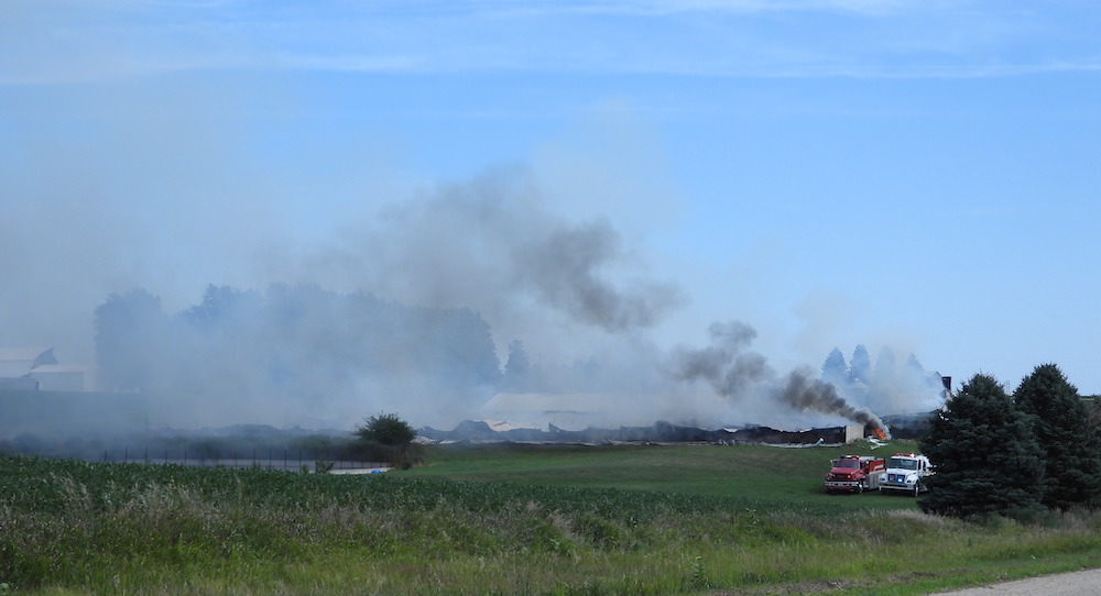 Multiple departments from three counties fight hog confinement fire near Pierson Iowa